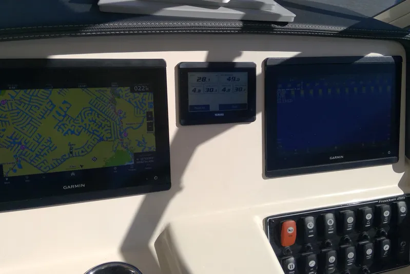  Yacht Photos Pics Dashboard of 2023 Grady-White Freedom 285 with Garmin navigation displays.