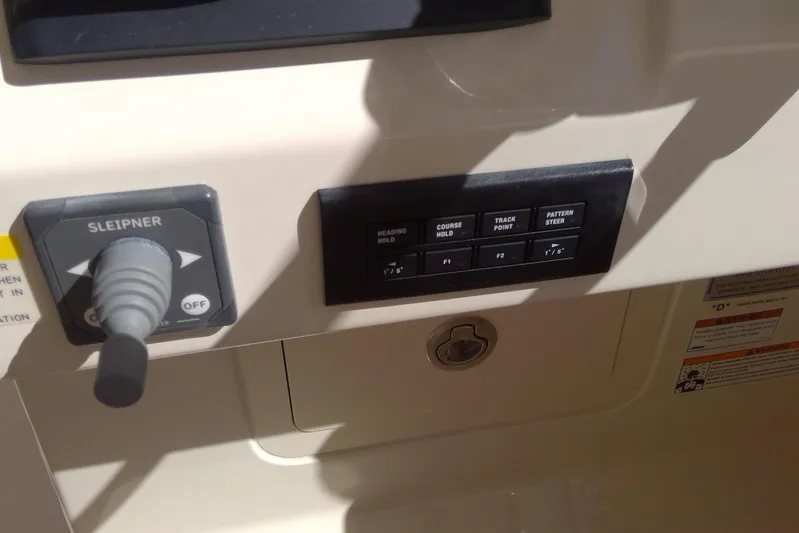  Yacht Photos Pics Control panel of 2023 Grady-White Freedom 285 boat with joystick and buttons.