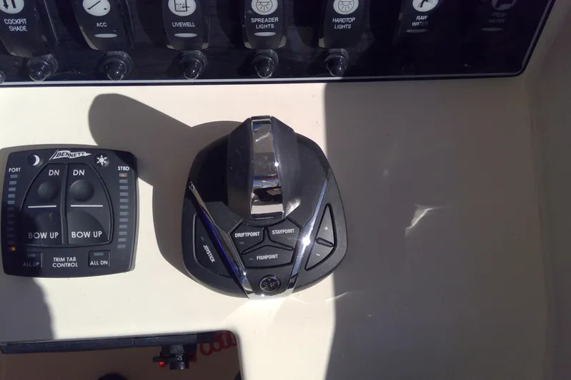  Yacht Photos Pics Control panel of 2023 Grady-White Freedom 285 boat with joystick and trim tab controls.