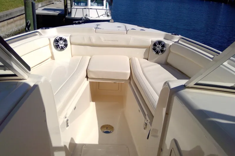  Yacht Photos Pics 2023 Grady-White Freedom 285 boat interior with cushioned seating and speakers.