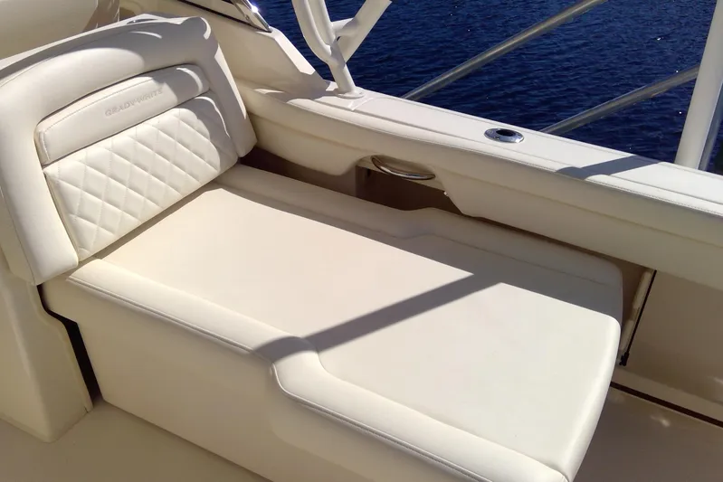  Yacht Photos Pics 2023 Grady-White Freedom 285 boat seat with white upholstery and ocean view.