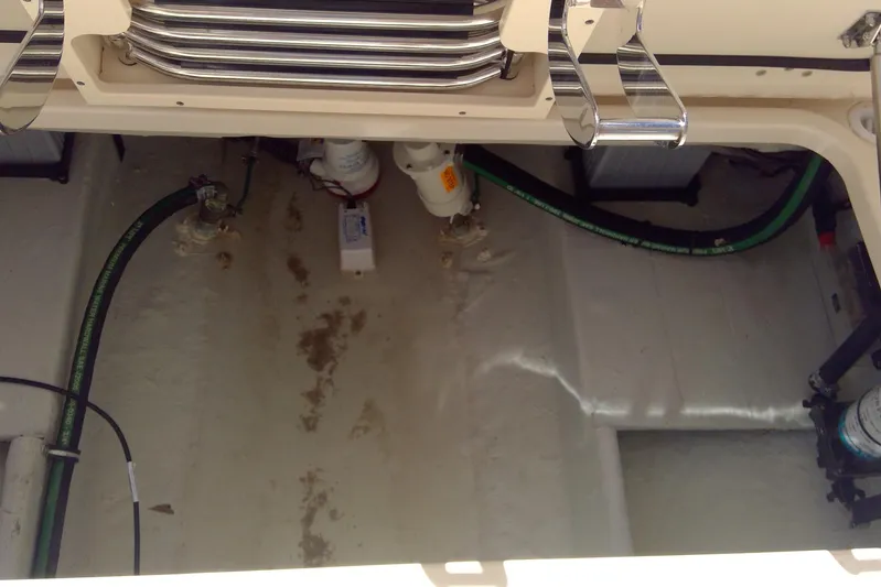 Yacht Photos Pics 2023 Grady-White Freedom 285 boat interior showing engine compartment details.