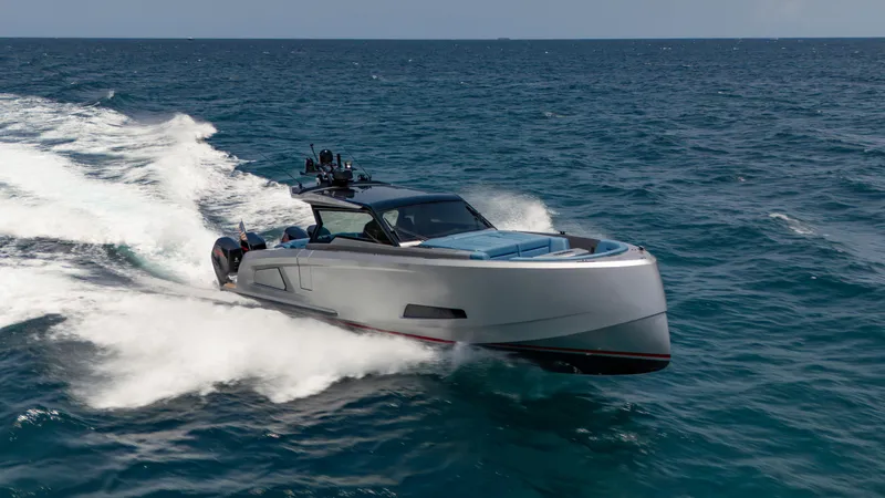 Robin's Nest Yacht Photos Pics 2023 Vanquish Yachts VQ45 cruising on open sea, showcasing sleek design and performance.