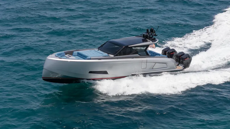 Robin's Nest Yacht Photos Pics 2023 Vanquish Yachts VQ45 cruising on open water, showcasing sleek design and powerful engines.
