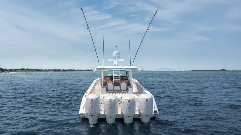  Yacht Photos Pics Everglades 455 boat, 2023 model, with multiple engines on open water.