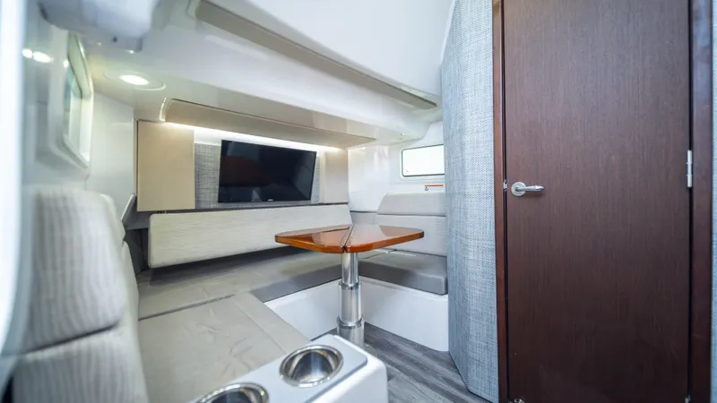  Yacht Photos Pics Interior of 2023 Everglades 455 boat with modern seating and TV.