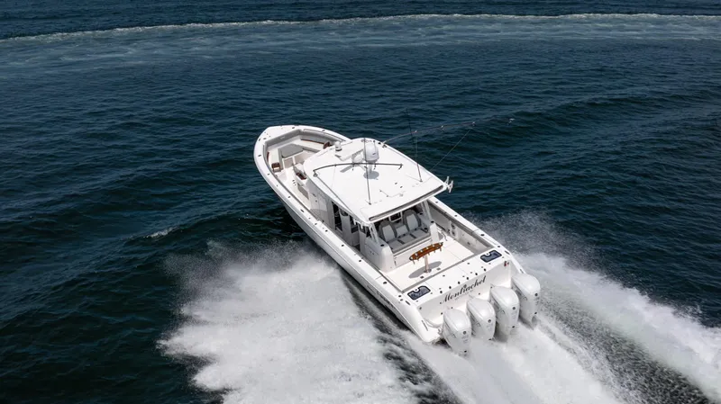  Yacht Photos Pics Everglades 455 boat cruising on open water, 2023 model.