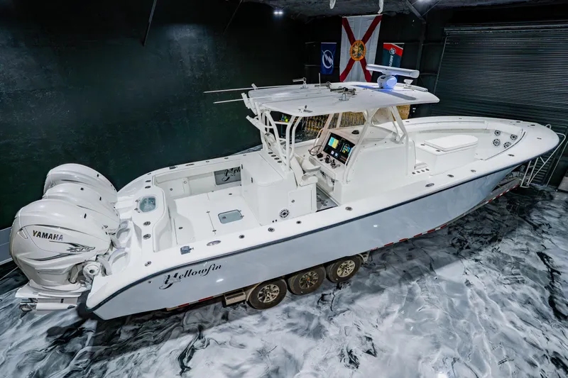  Yacht Photos Pics 2012 Yellowfin 39 Offshore boat with Yamaha engines in a showroom setting.
