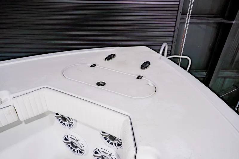  Yacht Photos Pics 2012 Yellowfin 39 Offshore boat deck with storage compartment and speakers.