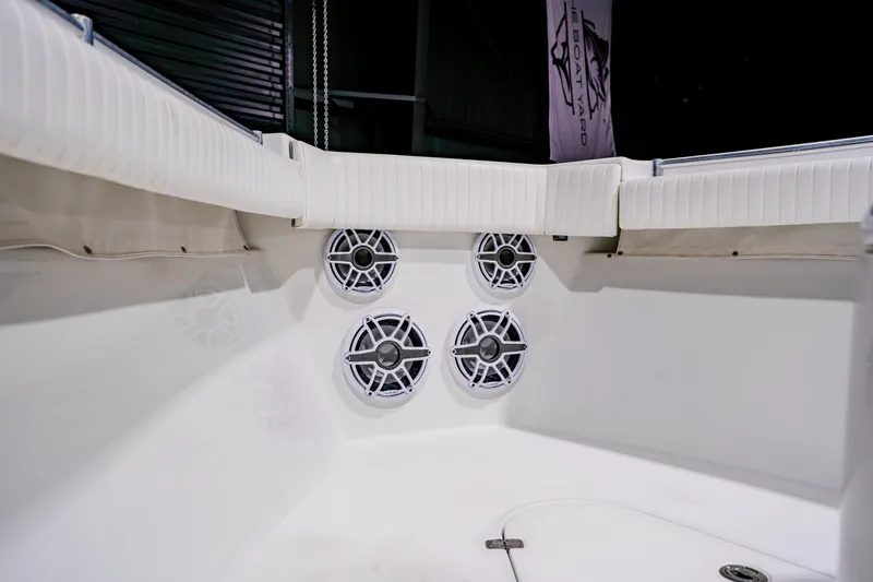  Yacht Photos Pics 2012 Yellowfin 39 Offshore boat interior with white seating and audio speakers.