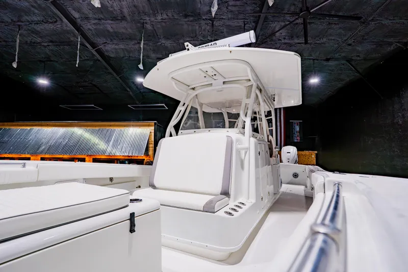 Yacht Photos Pics 2012 Yellowfin 39 Offshore boat interior with sleek white seating and modern design.