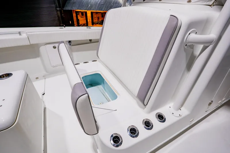  Yacht Photos Pics 2012 Yellowfin 39 Offshore boat interior with seating and storage compartment.