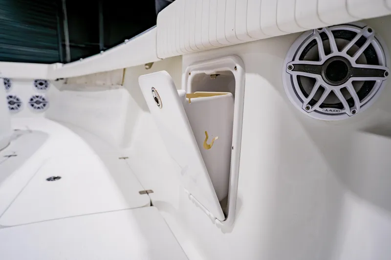  Yacht Photos Pics 2012 Yellowfin 39 Offshore boat interior with speaker and storage compartment.