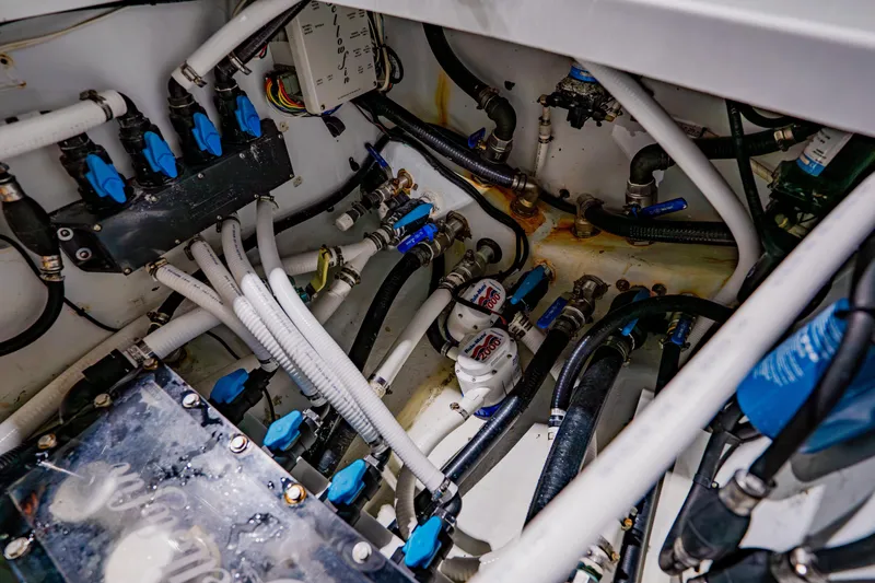  Yacht Photos Pics Engine compartment of 2012 Yellowfin 39 Offshore boat with visible hoses and connections.