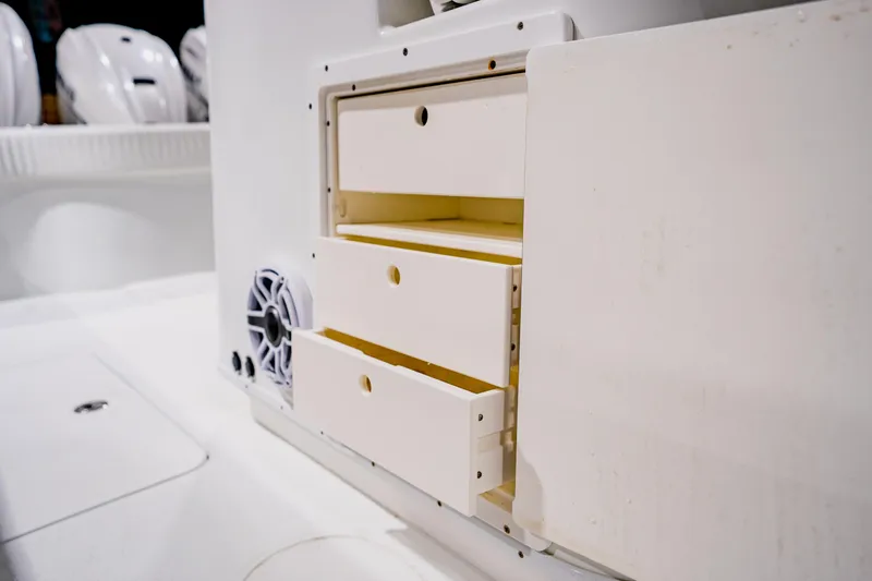  Yacht Photos Pics 2012 Yellowfin 39 Offshore boat interior with storage drawers and speaker.