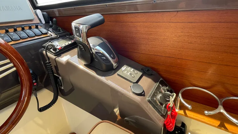  Yacht Photos Pics Control panel of 2022 Ranger Tugs R-25 boat with throttle and switches.