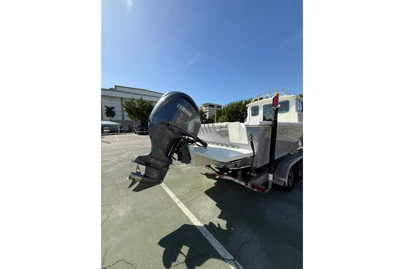  Yacht Photos Pics 2023 Parker 2320 Sport Cabin boat with Yamaha outboard motor on trailer.