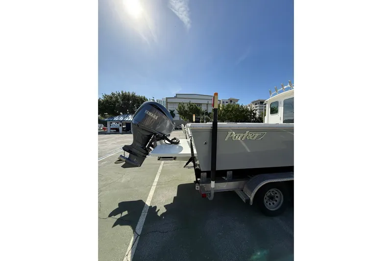  Yacht Photos Pics 2023 Parker 2320 Sport Cabin boat with Yamaha outboard motor on trailer.