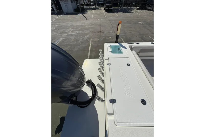  Yacht Photos Pics 2023 Parker 2320 Sport Cabin boat deck with engine and storage compartments.