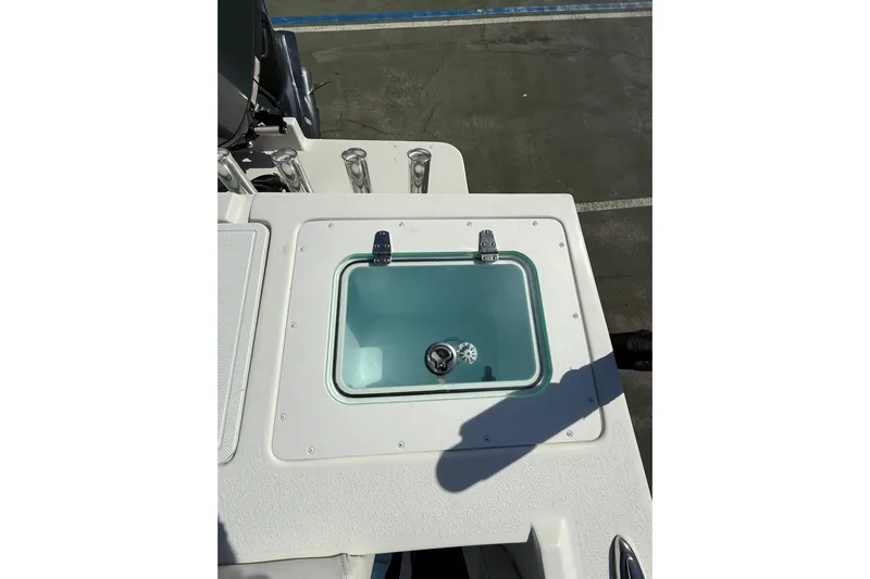  Yacht Photos Pics Livewell on 2023 Parker 2320 Sport Cabin boat, featuring rod holders and clean design.