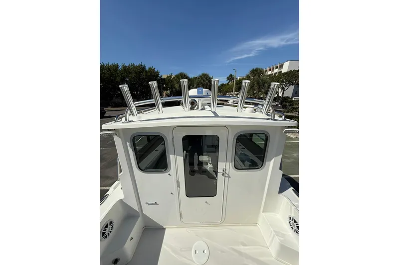  Yacht Photos Pics 2023 Parker 2320 Sport Cabin boat with rod holders, viewed from the deck.