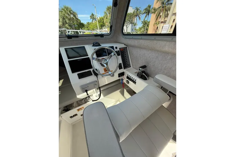  Yacht Photos Pics Interior of 2023 Parker 2320 Sport Cabin boat with steering wheel and controls.