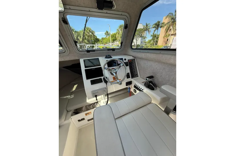  Yacht Photos Pics 2023 Parker 2320 Sport Cabin interior with steering wheel and control panel.
