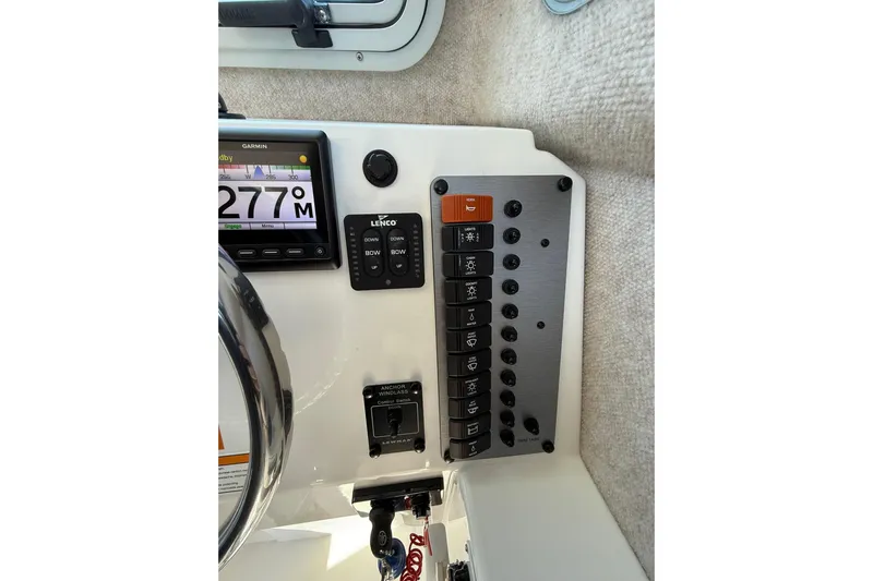 Yacht Photos Pics Control panel of 2023 Parker 2320 Sport Cabin boat with Garmin display and switches.