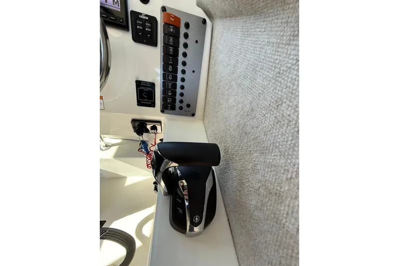  Yacht Photos Pics Control panel of 2023 Parker 2320 Sport Cabin boat with throttle and switches.