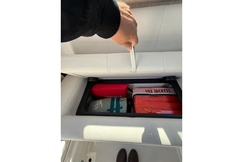  Yacht Photos Pics 2023 Parker 2320 Sport Cabin storage with life jackets and safety gear.