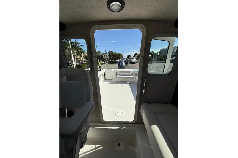  Yacht Photos Pics Interior view of 2023 Parker 2320 Sport Cabin boat, showing seating and open deck.