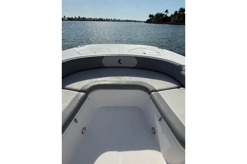  Yacht Photos Pics 2026 Falcon Boats 26 model, featuring spacious seating, on a serene water backdrop.