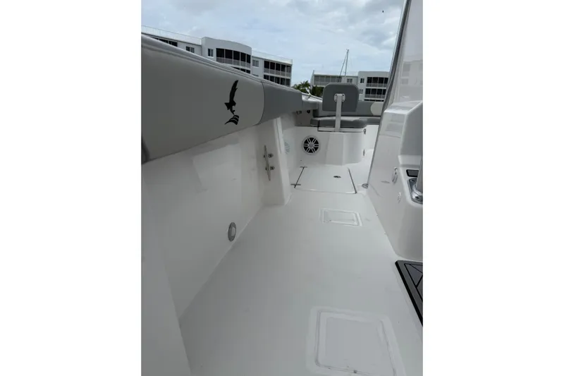  Yacht Photos Pics Interior view of 2026 Falcon Boats 26, featuring sleek white deck and seating.