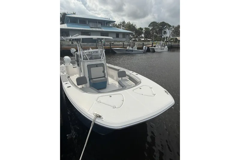  Yacht Photos Pics 2026 Falcon Boats 26 docked, featuring sleek design and spacious deck.