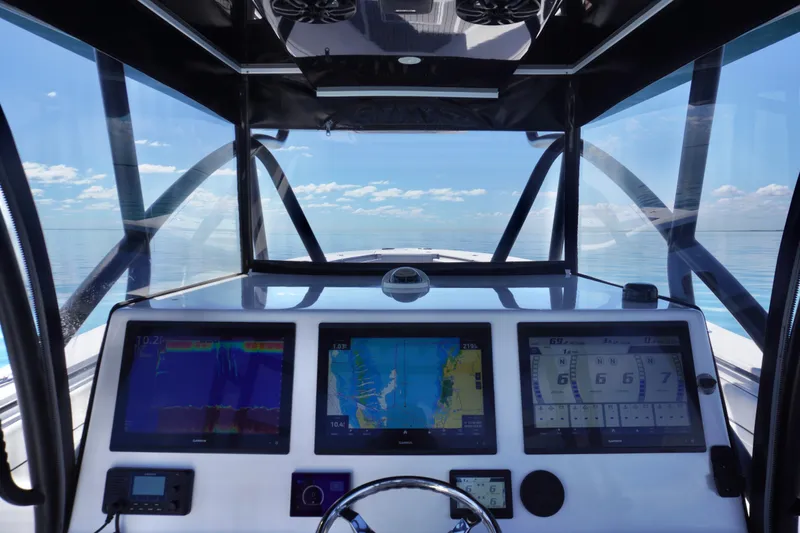  Yacht Photos Pics Cockpit view of 2019 SeaHunter 45 Tournament with navigation screens and ocean horizon.