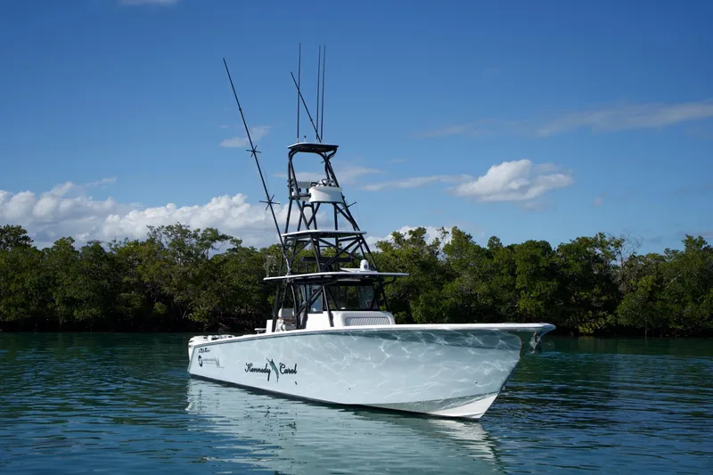  Yacht Photos Pics 2019 SeaHunter 45 Tournament boat on calm water with lush green background.