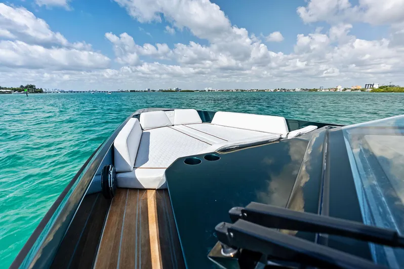 Green Eyes Yacht Photos Pics 2023 Wally Wallytender 43X yacht on turquoise water under a blue sky.