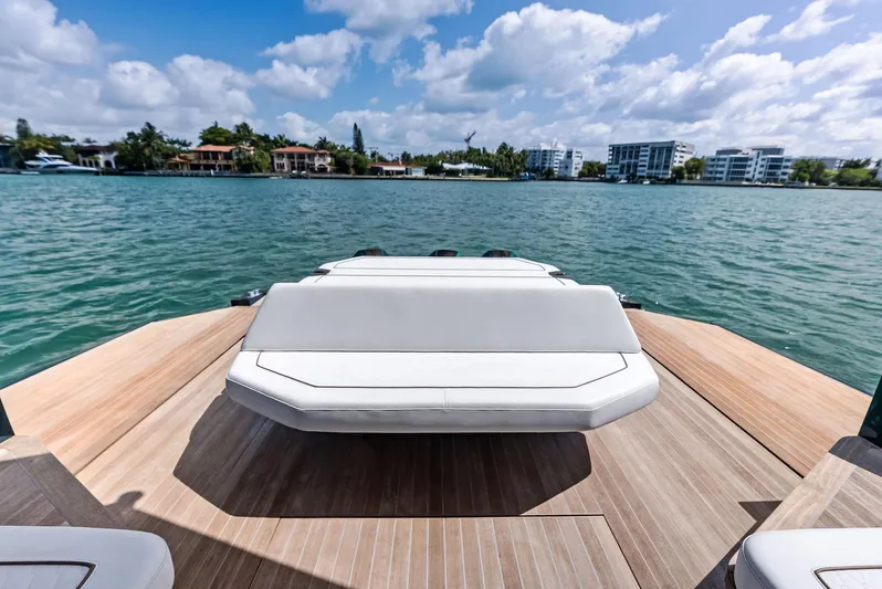 Green Eyes Yacht Photos Pics 2023 Wally Wallytender 43X yacht with sleek deck, scenic waterfront view.