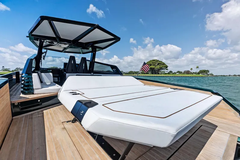 Green Eyes Yacht Photos Pics 2023 Wally Wallytender 43X luxury yacht with sunbed, sleek design, and ocean view.