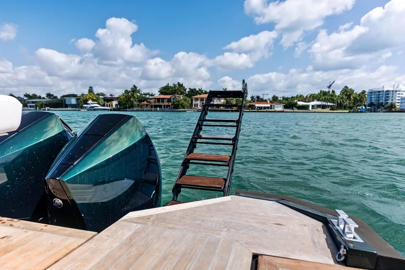 Green Eyes Yacht Photos Pics 2023 Wally Wallytender 43X yacht with ladder, docked on a sunny day.