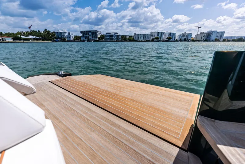 Green Eyes Yacht Photos Pics 2023 Wally Wallytender 43X yacht deck with ocean view and city skyline.