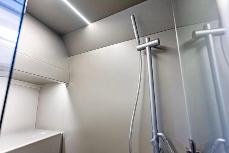 Green Eyes Yacht Photos Pics Modern shower area in 2023 Wally Wallytender 43X yacht, featuring sleek design and lighting.