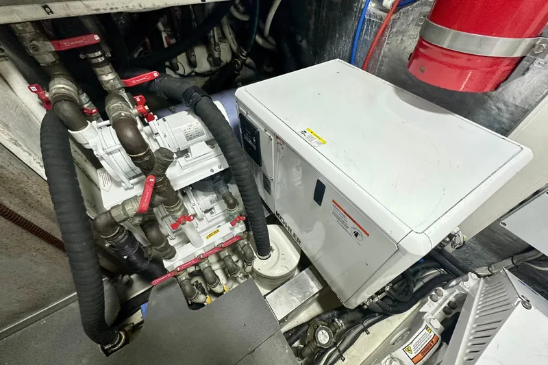  Yacht Photos Pics Engine room of 2016 Absolute 72 FLY yacht with mechanical components and piping.