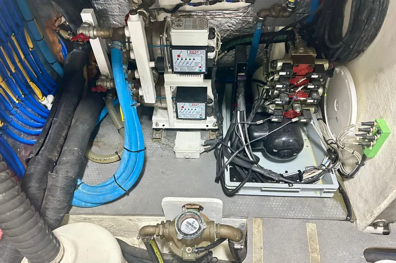  Yacht Photos Pics Engine room of a 2016 Absolute 72 FLY yacht with complex wiring and machinery.