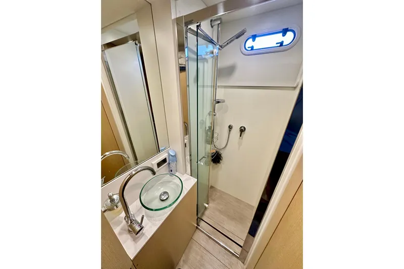  Yacht Photos Pics Luxurious bathroom in 2016 Absolute 72 FLY yacht with glass shower and modern sink.