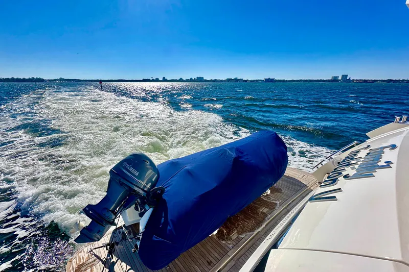  Yacht Photos Pics Luxury yacht Absolute 72 FLY cruising on open water, Yamaha engine visible.