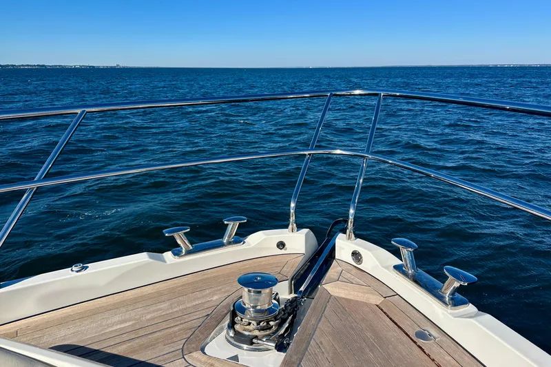  Yacht Photos Pics Bow view of Absolute 72 FLY yacht cruising on open sea, 2016 model.
