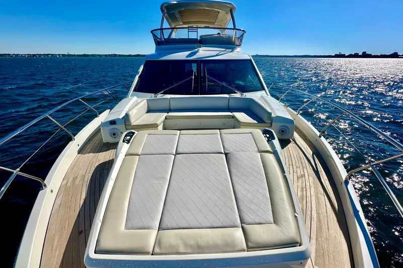  Yacht Photos Pics Luxurious 2016 Absolute 72 FLY yacht on open water, featuring spacious sunbathing deck.