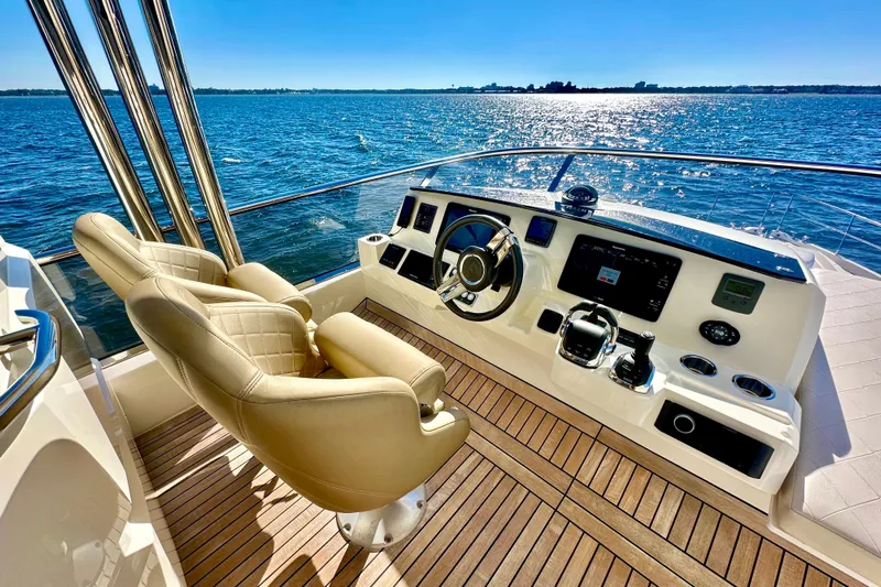  Yacht Photos Pics Luxurious helm of 2016 Absolute 72 FLY yacht with ocean view and modern controls.