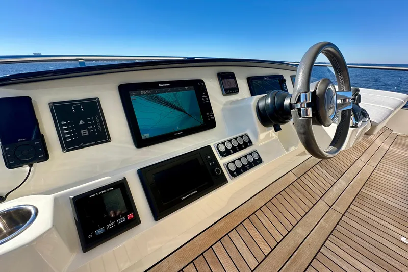  Yacht Photos Pics Helm of 2016 Absolute 72 FLY yacht with navigation screens and steering wheel.
